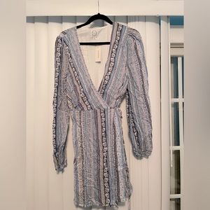 NWT Francesca’s long sleeved wrap dress.